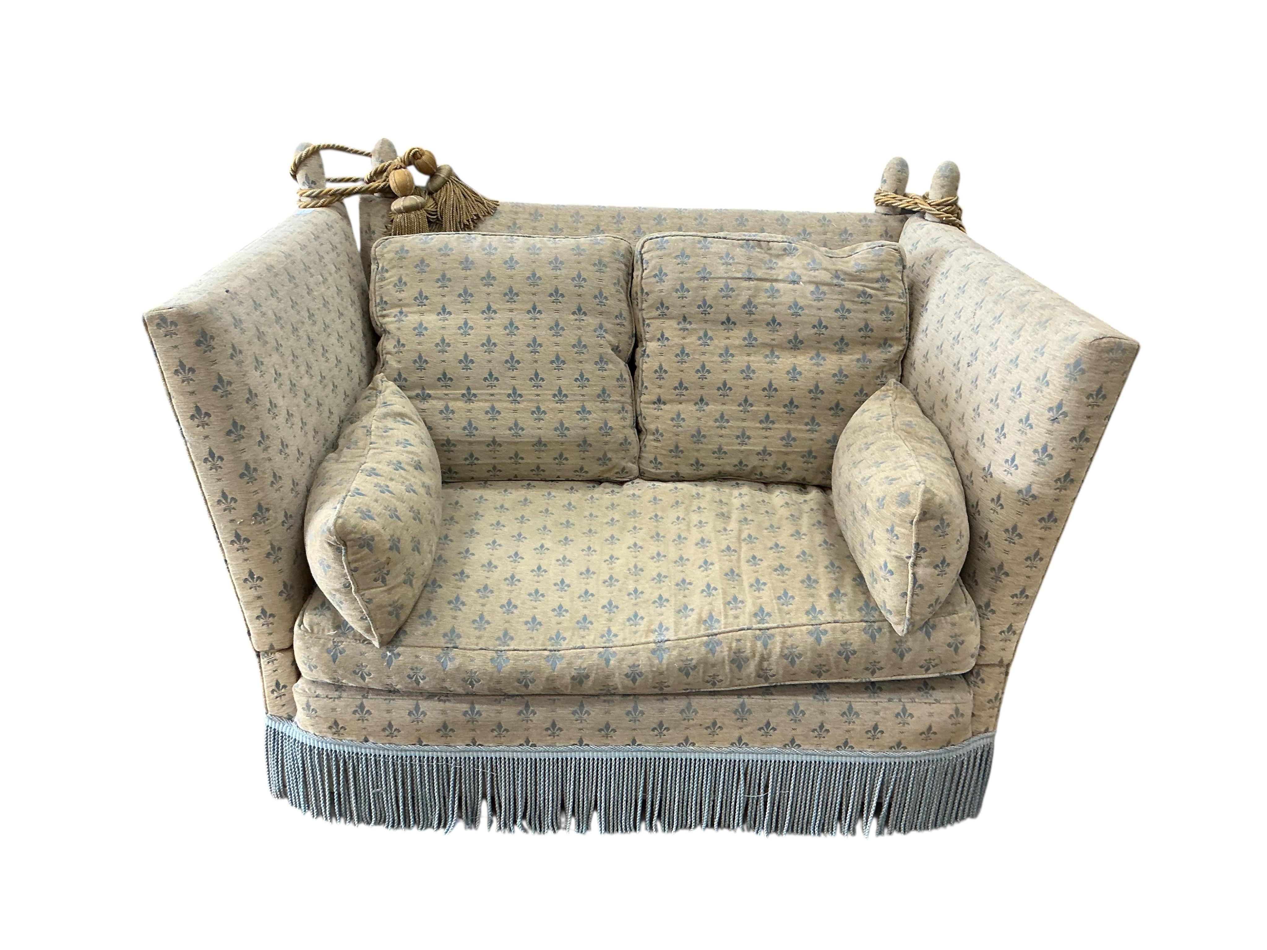 A small Knole upholstered settee, width 144cm, depth 90cm, height 100cm